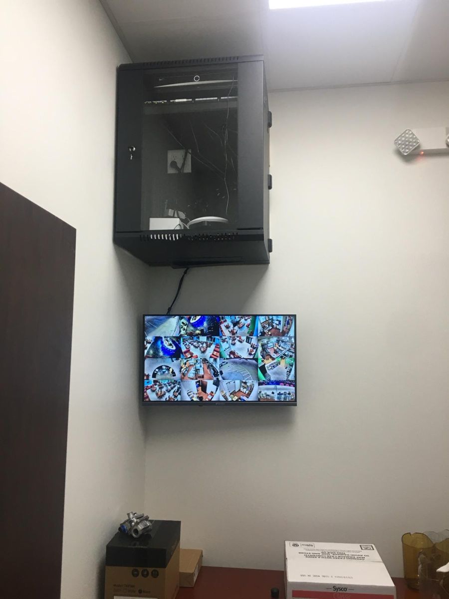 Wall cabinet with live camera monitor below
